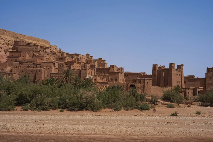 Ancient mud-brick village nestled in a desert landscape.
